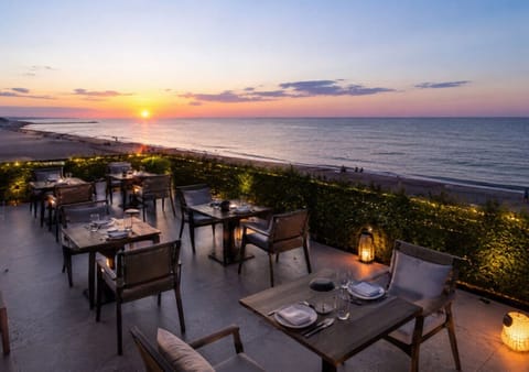 Private beach, black sand, sun loungers, beach umbrellas
