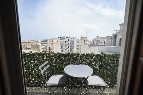 Deluxe Triple Room, Balcony, City View | Terrace/patio