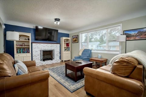 Main floor living room w/ 65 inch TV