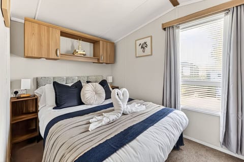Bedroom one features a comfortable double bed with fresh linen and towels provided.