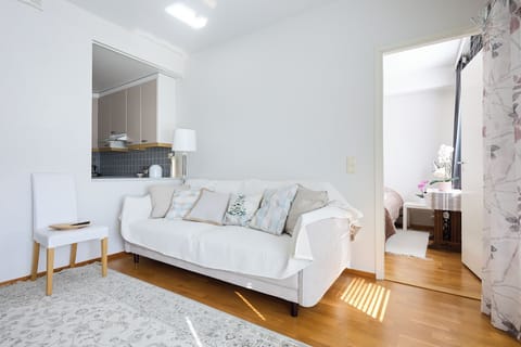Standard Apartment, Courtyard View | Living area | 30-inch TV with cable channels