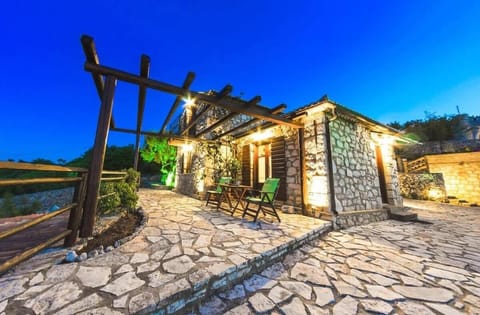5. Exterior – Main Entrance

Traditional stone house with beautiful outdoor lighting and private entrance, welcoming guests into a charming and authentic setting.