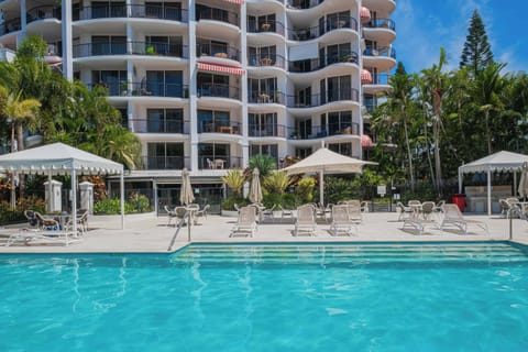 Outdoor Pool: Splash around in the sun-soaked outdoor pool, surrounded by lush greenery.