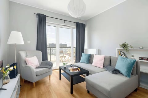 Relax in the stylish living room with a comfortable sofa and modern decor.