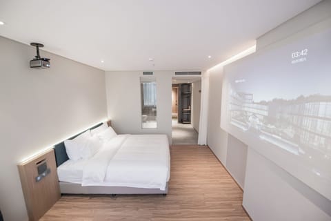 Premium bedding, down comforters, memory foam beds, free minibar