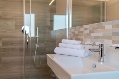 Premium bedding, down comforters, memory foam beds, minibar