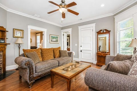 Living Room: Stylish and comfortable living area with natural light and a cozy couch. Ideal for lounging, socializing, or enjoying a quiet evening in.