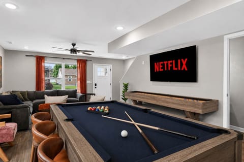 Living Room 1: Enjoy the best of both worlds in Unit A's living room, featuring a relaxing lounge space and a game area designed for memorable moments together.