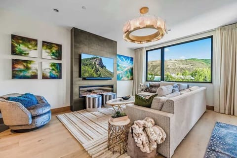 Living room: Valley views, gas fireplace, 65” Smart TV, Sonos soundbar, balcony access