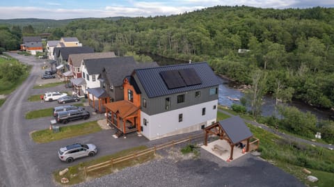 First house on the right. Pavilion, extra parking and charcoal grill next door. 