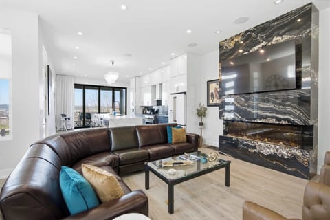 Curl up in the chic living room & stream your favorites on the smart TV​