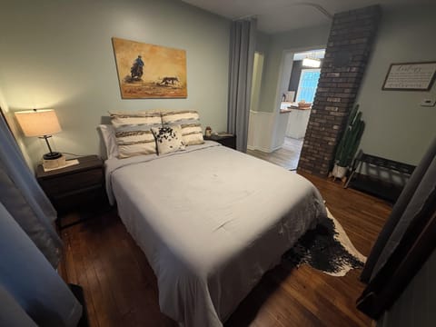 Queen bedroom with privacy curtains.