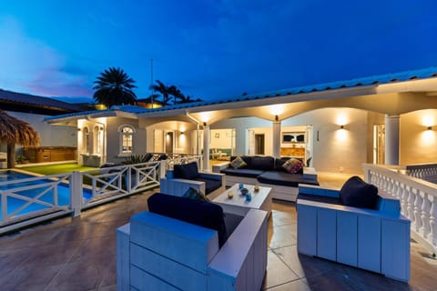 Sunset terrace overlooking Spanish Water with constant breeze and open waterfront views
