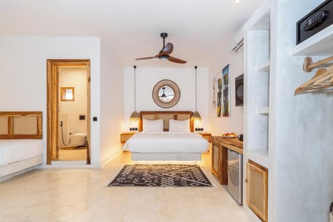 Deluxe Quadruple Room, Garden View | In-room safe, desk, laptop workspace, iron/ironing board (on request)