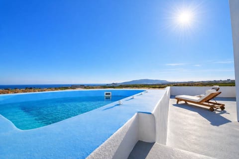 Private jacuzzi overlooking blue skies and sea views. Relax on the terrace, take a refreshing dip, and enjoy the peaceful surroundings. Perfect for unwinding with a morning coffee or an evening drink 