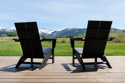 Relax in the Adirondack chairs on the back deck, perfectly positioned to take in uninterrupted views of the Tetons.