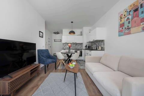 Relax in the stylish living room with a comfortable sofa and modern decor.