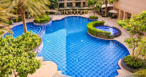 2 outdoor pools, open 8:00 AM to 10:00 PM, pool umbrellas, sun loungers