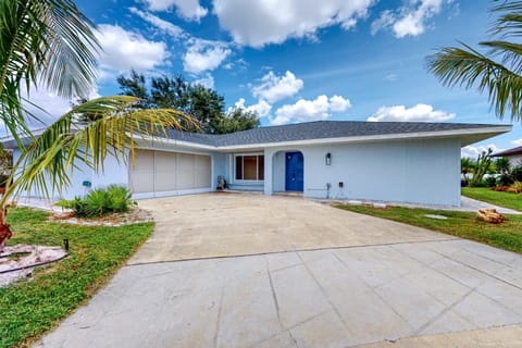 Inviting exterior with convenient parking for up to three vehicles.