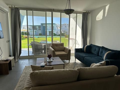 Chalet, 3 Bedrooms, Lagoon View | Living area | Flat-screen TV
