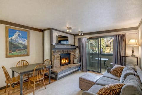 Living Room with Fireplace and Dining - Sofa is a Pull-out with