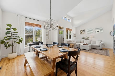 Dining table with soaring ceilings and natural light.