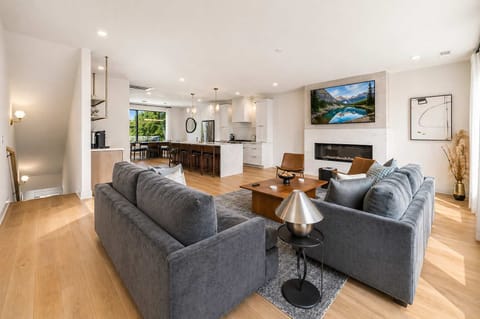 Living Room: Stylish living space featuring a comfy sofa, modern décor, and a flat-screen TV. Ideal for unwinding, socializing, or simply enjoying a peaceful moment indoors.