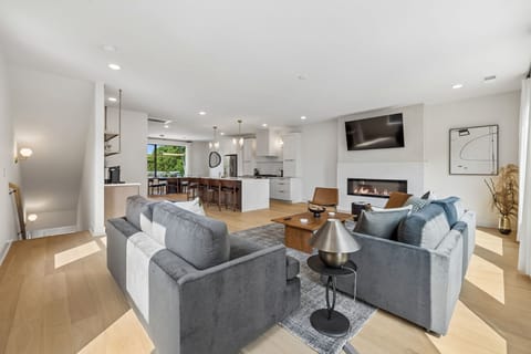 Living Room: Stylish living space featuring a comfy sofa, modern décor, and a flat-screen TV. Ideal for unwinding, socializing, or simply enjoying a peaceful moment indoors.