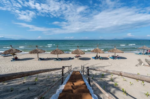 On the beach, white sand, free beach cabanas, sun loungers