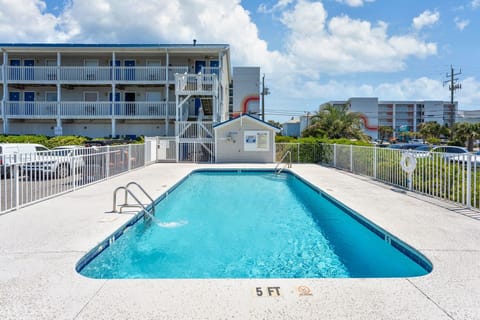 Dive into crystal-clear waters at your private pool oasis, surrounded by tropical palms and sunny Florida skies for the perfect vacation escape.