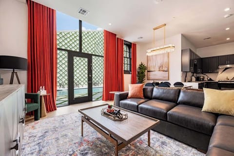 Living Area opens up to pool. Features queen-size sleeper sofa.