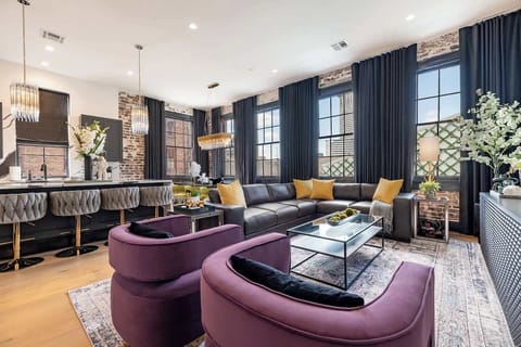 Living / Dining Area. Fully stocked kitchen with island and counter dining for four. Table dining for eight. Queen-size sleeper sofa.