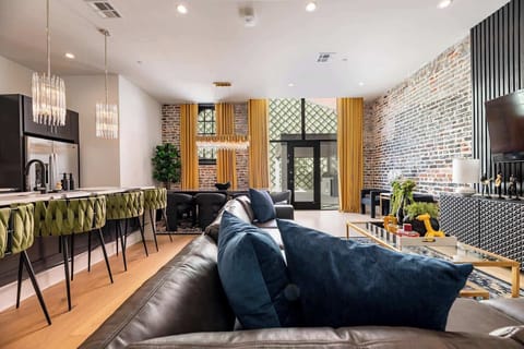 Living Room opens up to pool. Features queen-size sleeper sofa.