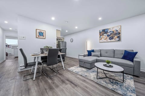 Living area connected to dining and kitchen.

