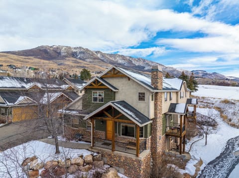 A stunning mountain residence nestled among snow-dusted peaks, where timeless alpine architecture and breathtaking surroundings create an unforgettable first impression.