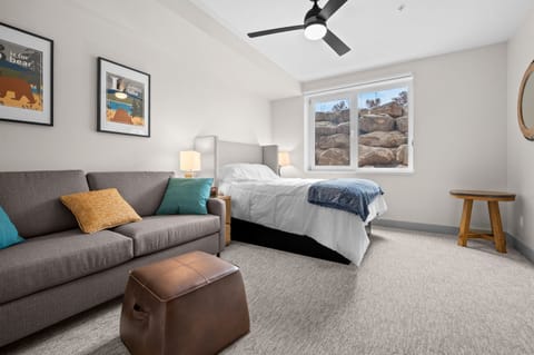 Spacious bedroom suite with lounge seating—perfect for relaxing beyond just sleeping.
