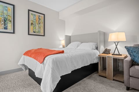 Plush bed with soft linens—designed for a restful night’s sleep.