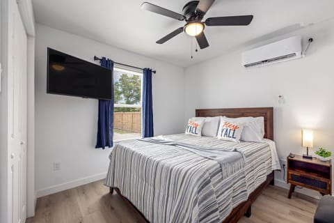 Well-appointed main room with a queen-size bed, private full bathroom, and TV for comfort and convenience.
