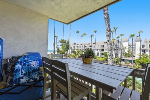 The perfect second-story vantage point—enjoy your meals outside while taking in the vibrant energy of the complex and the blue horizon in the distance.
