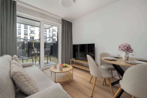 Relax in the stylish living room with a comfortable sofa and modern decor.