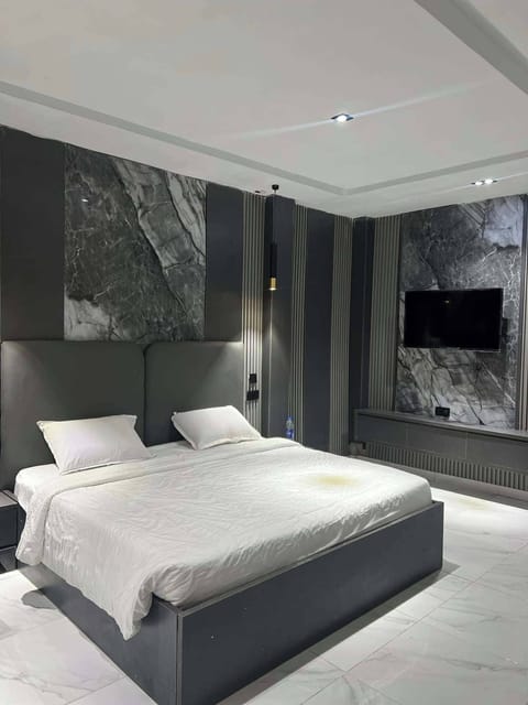Deluxe Room, Balcony, City View | In-room safe, desk, laptop workspace, blackout drapes