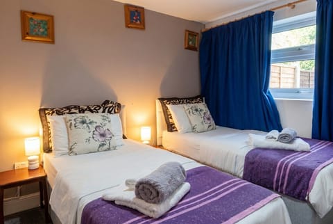 Three cosy beds with fresh linens make this room perfect for groups.