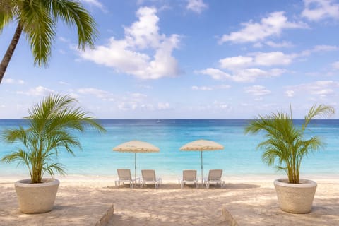Beach nearby, white sand, sun loungers, beach umbrellas