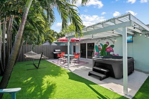 beautiful, tropical, and private backyard with hot tub!