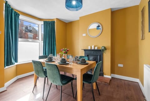 Dining table with seating for meals, coffee, and catching up together
