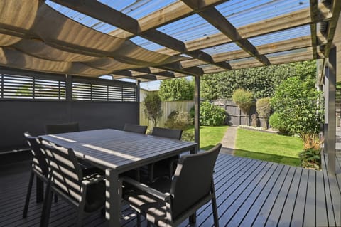 Covered deck with BBQ and outdoor dining