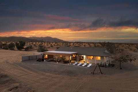Watch the desert glow as the sun sets behind the mountains.