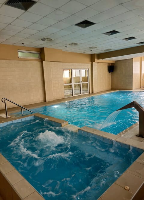 Indoor pool, sun loungers