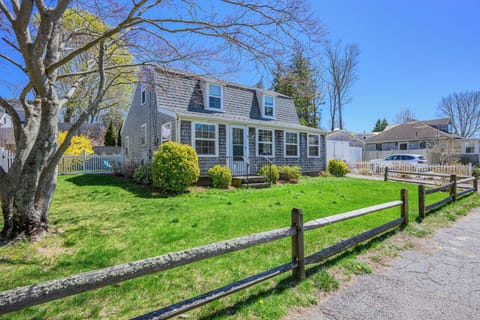 Inviting front exterior with lush green lawn