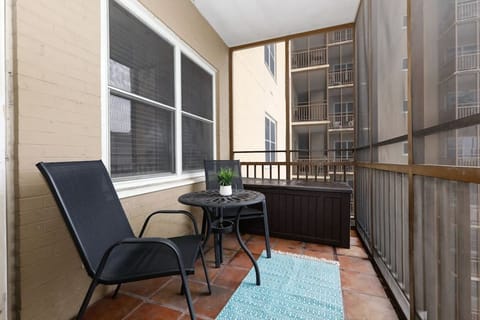 Cozy balcony nook w/ chairs & table for relaxed outdoor moments